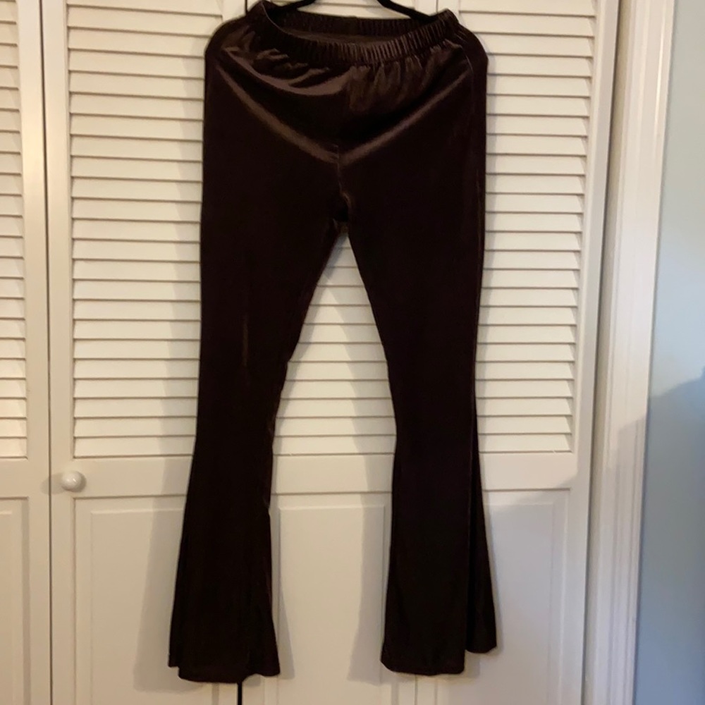 Brown, stretch, bell bottom pants. Elastic waist. Never worn bc got wrong size